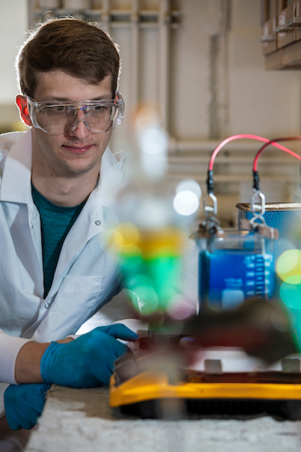 Graduate student, Joe Bauer, tests materials in a lab.
